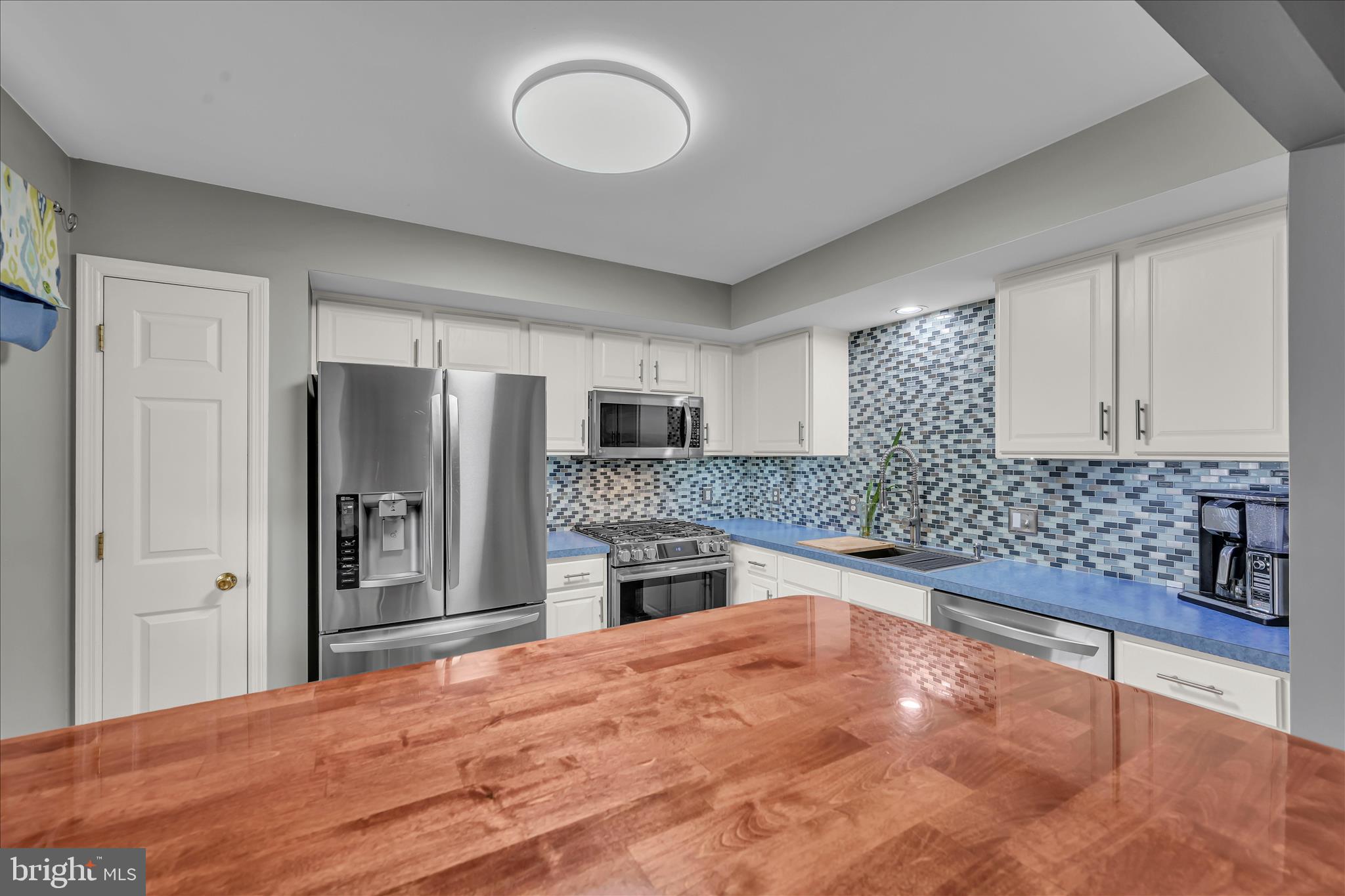 247 Bainbridge Circle Reading, PA 19608 - Photo 8 of 30 a kitchen with stainless steel appliances granite countertop a refrigerator and a stove top oven
