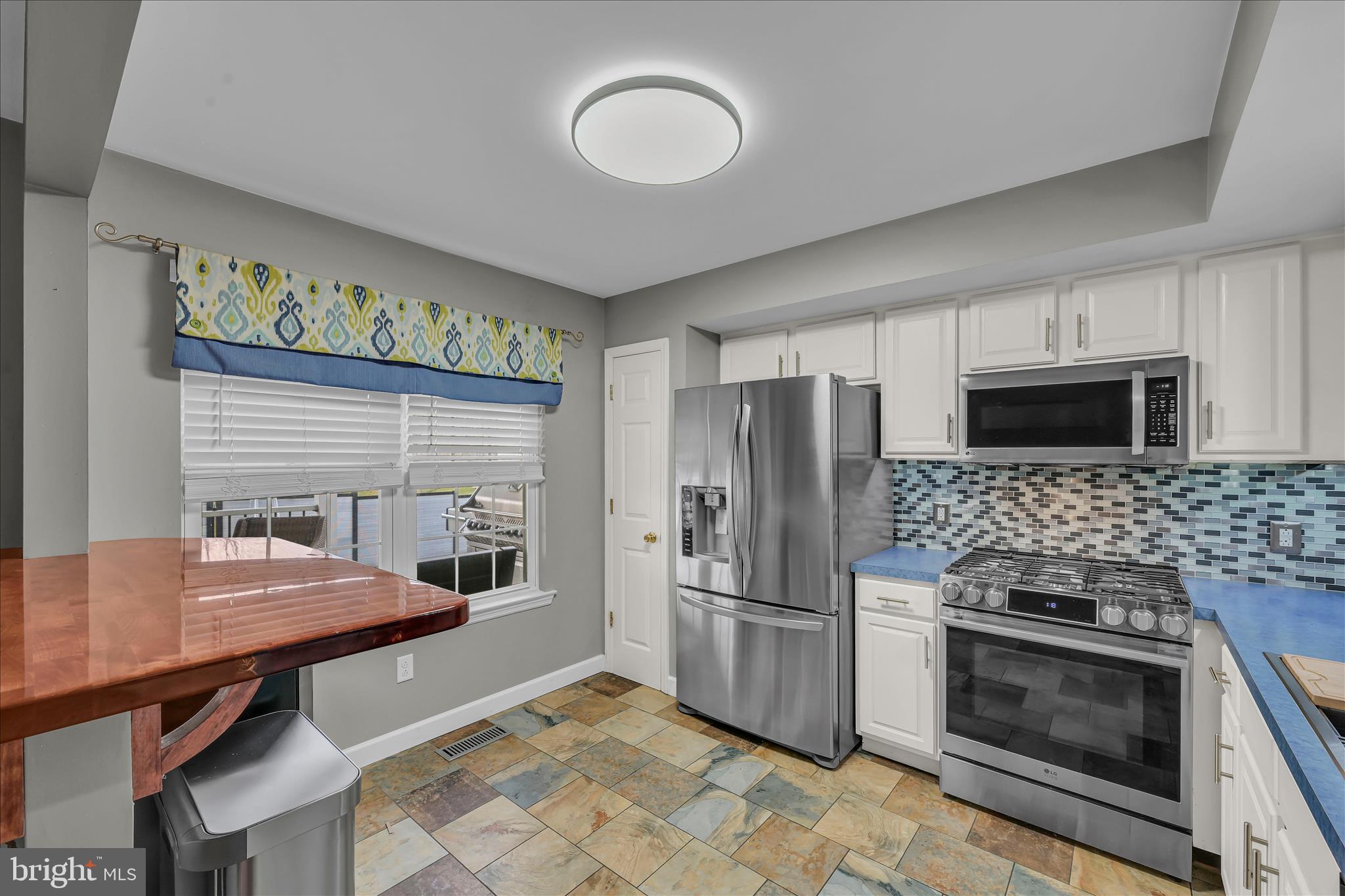 247 Bainbridge Circle Reading, PA 19608 - Photo 9 of 30 a kitchen with stainless steel appliances kitchen island granite countertop a stove and a refrigerator
