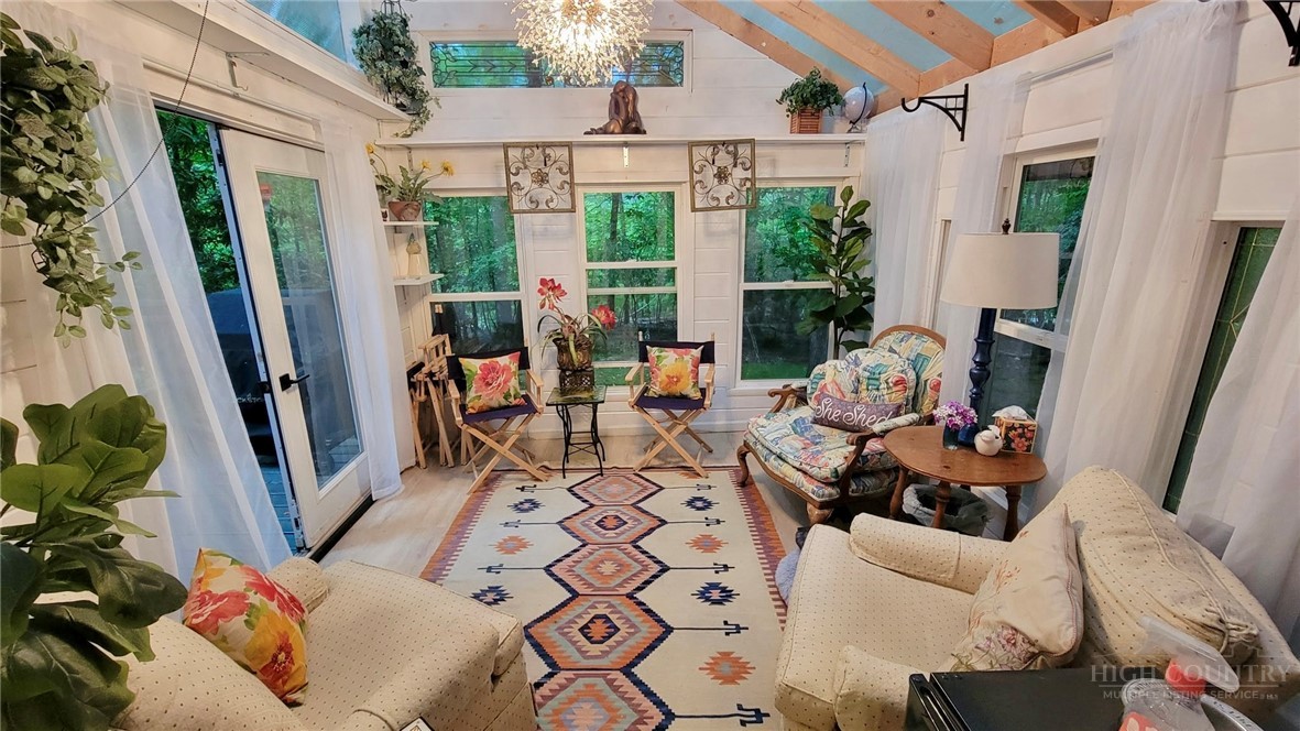 111 Locust Ridge Road Beech Mountain, NC 28604 - Photo 5 of 21 a view of balcony with furniture and a potted plant
