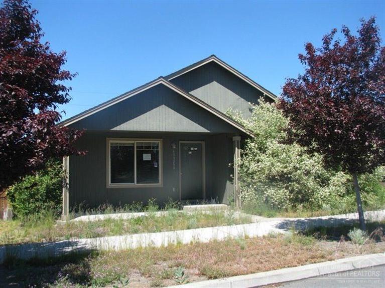 63323 Vogt Road Bend, OR 97701 - Photo 6 of 18 a front view of a house with a yard