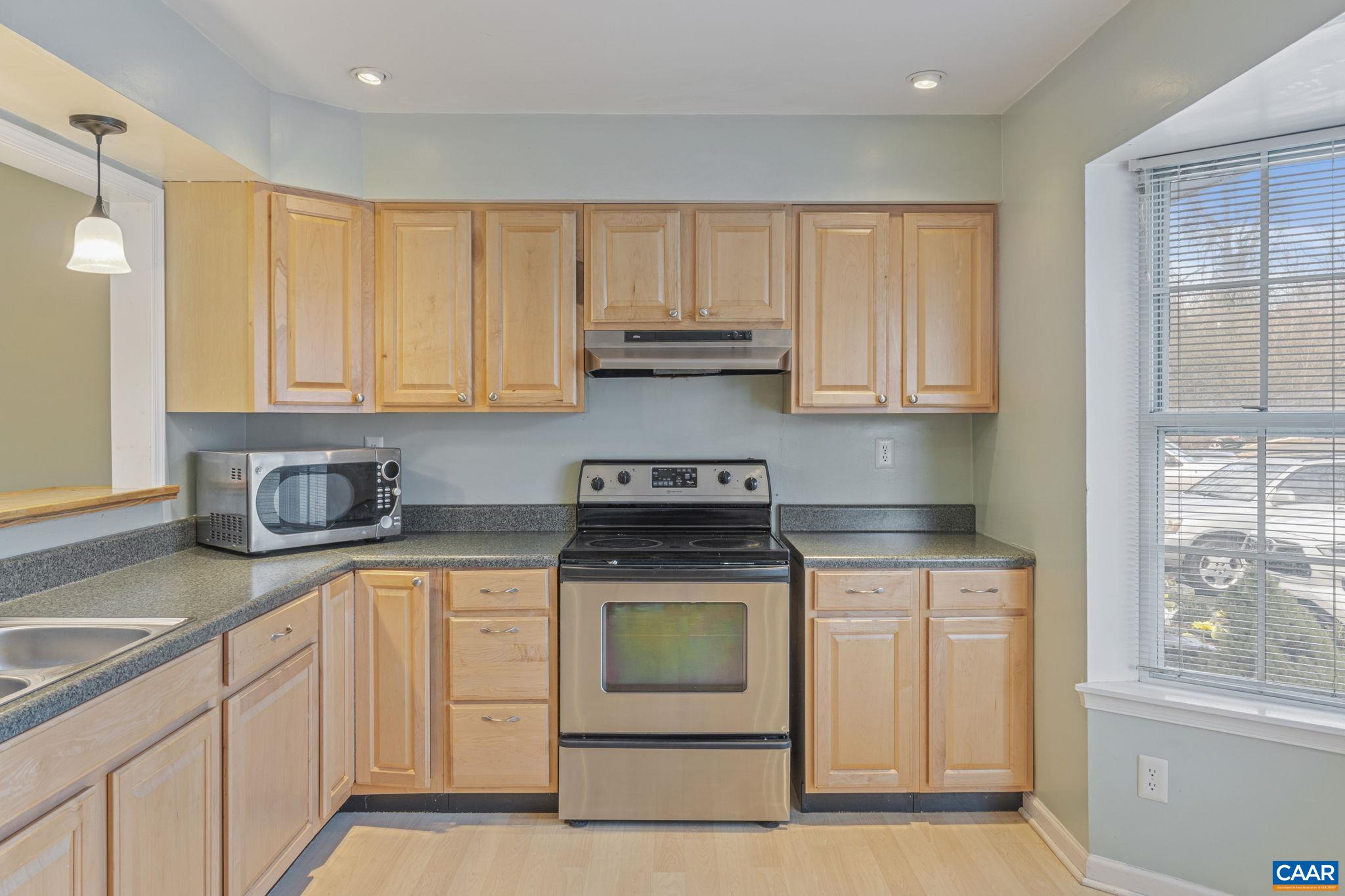 1659 Cool Spring Road Charlottesville, VA 22901 - Photo 6 of 26 a kitchen with granite countertop wood cabinets and a stove