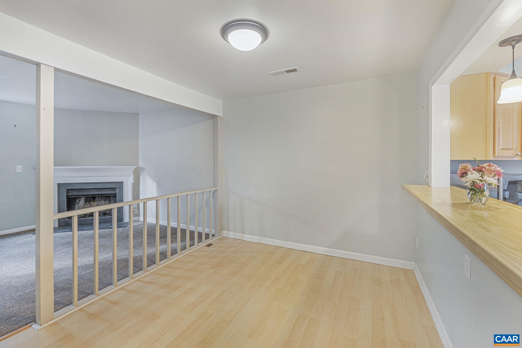 1659 Cool Spring Road Charlottesville, VA 22901 - Photo 9 of 26 a view of a hallway to kitchen and wooden floor