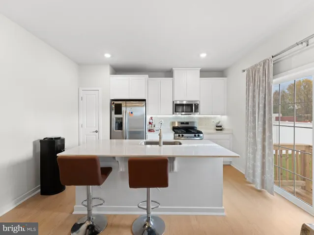 a kitchen with a sink and a refrigerator