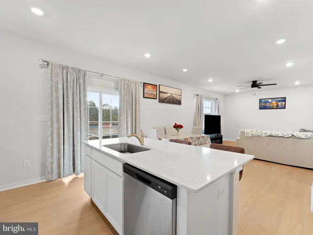 a bed room with furniture and a flat screen tv