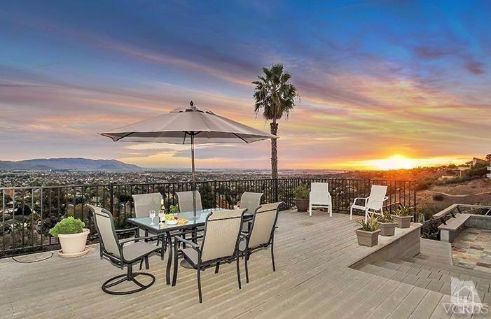 a view of a terrace with furniture and garden