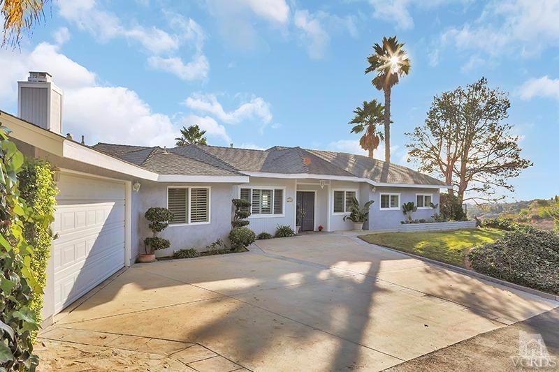 520 San Clemente Way Camarillo, CA 93010 - Photo 2 of 49 a front view of a house with a garden and trees