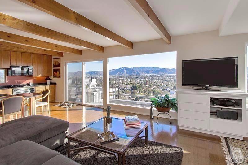 520 San Clemente Way Camarillo, CA 93010 - Photo 3 of 49 a living room with furniture a flat screen tv and a floor to ceiling window