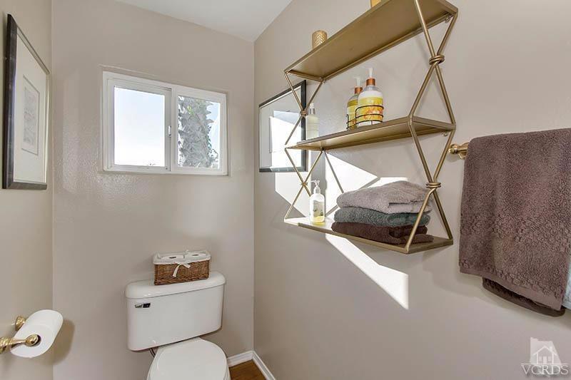 520 San Clemente Way Camarillo, CA 93010 - Photo 32 of 49 a bathroom with a toilet a sink and mirror