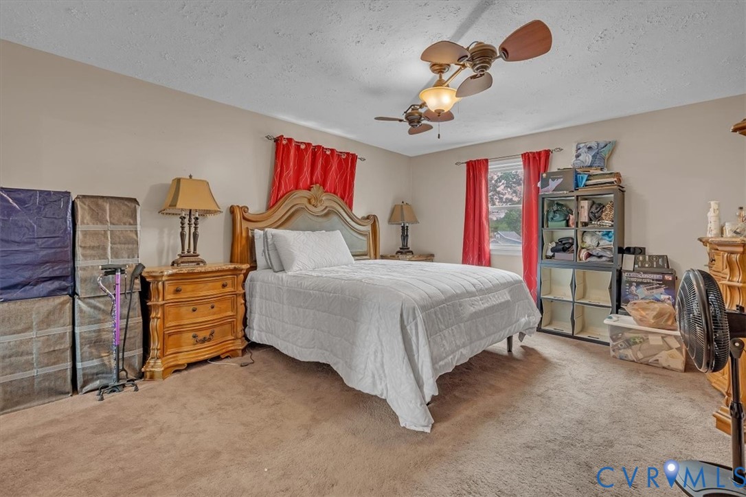 406 Windmere Drive Colonial Heights, VA 23834 - Photo 13 of 29 a bedroom with a bed and dresser