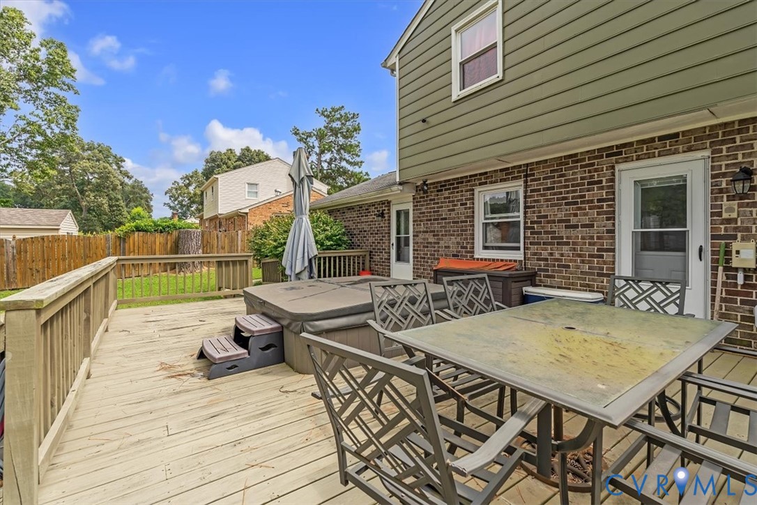406 Windmere Drive Colonial Heights, VA 23834 - Photo 22 of 29 a view of a patio with table and chairs with wooden floor and fence