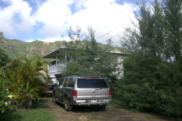 311 Kamokila Road Kapaa, HI 96746 - Photo 2 of 3 a car parked in front of a house