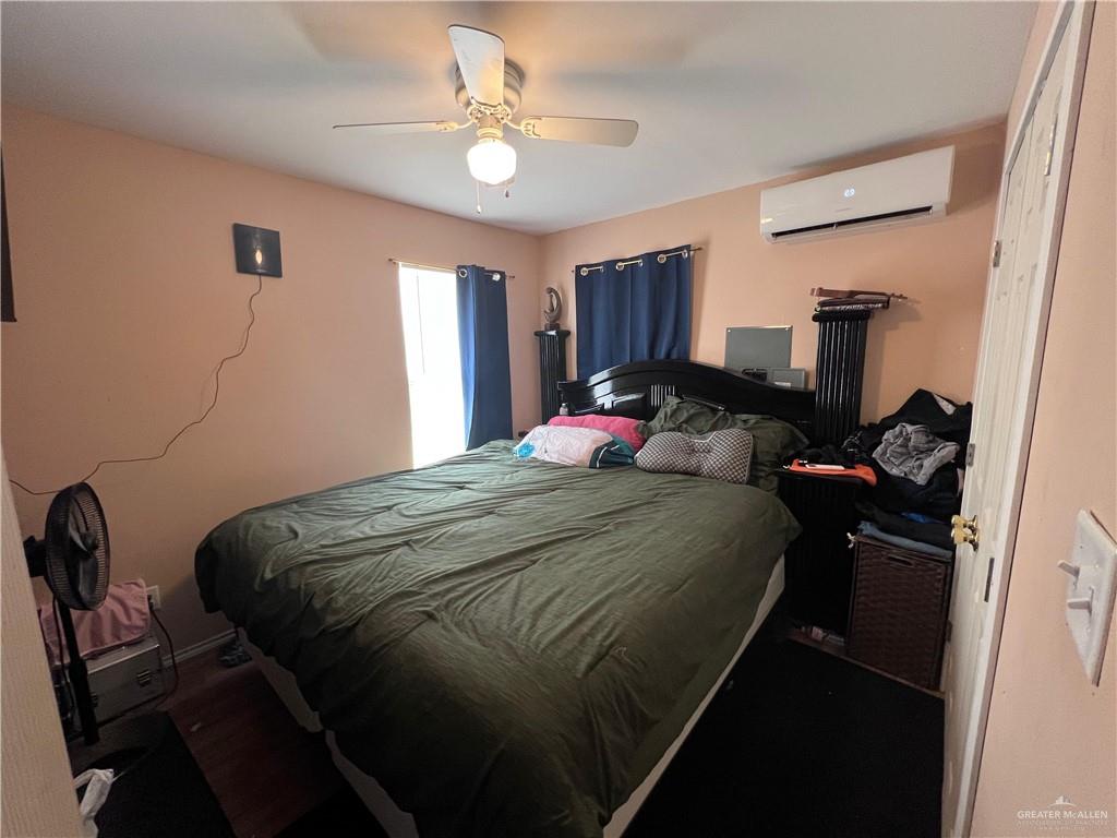 38416 El Quelite Road Penitas, TX 78576 - Photo 11 of 20 a bedroom with a bed and a chandelier