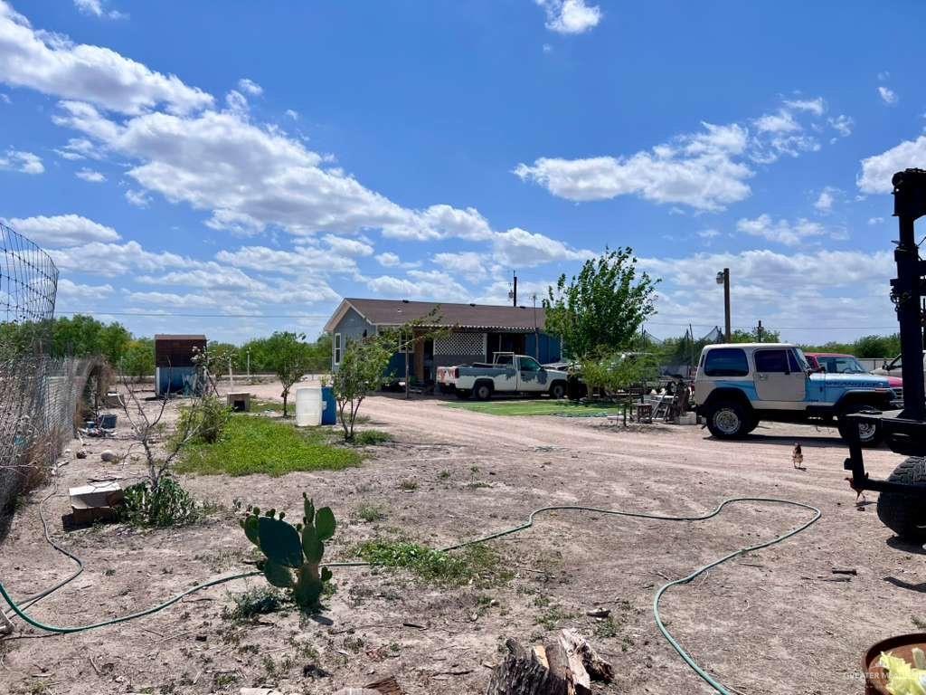 38416 El Quelite Road Penitas, TX 78576 - Photo 18 of 20 a view of a yard with cars parked