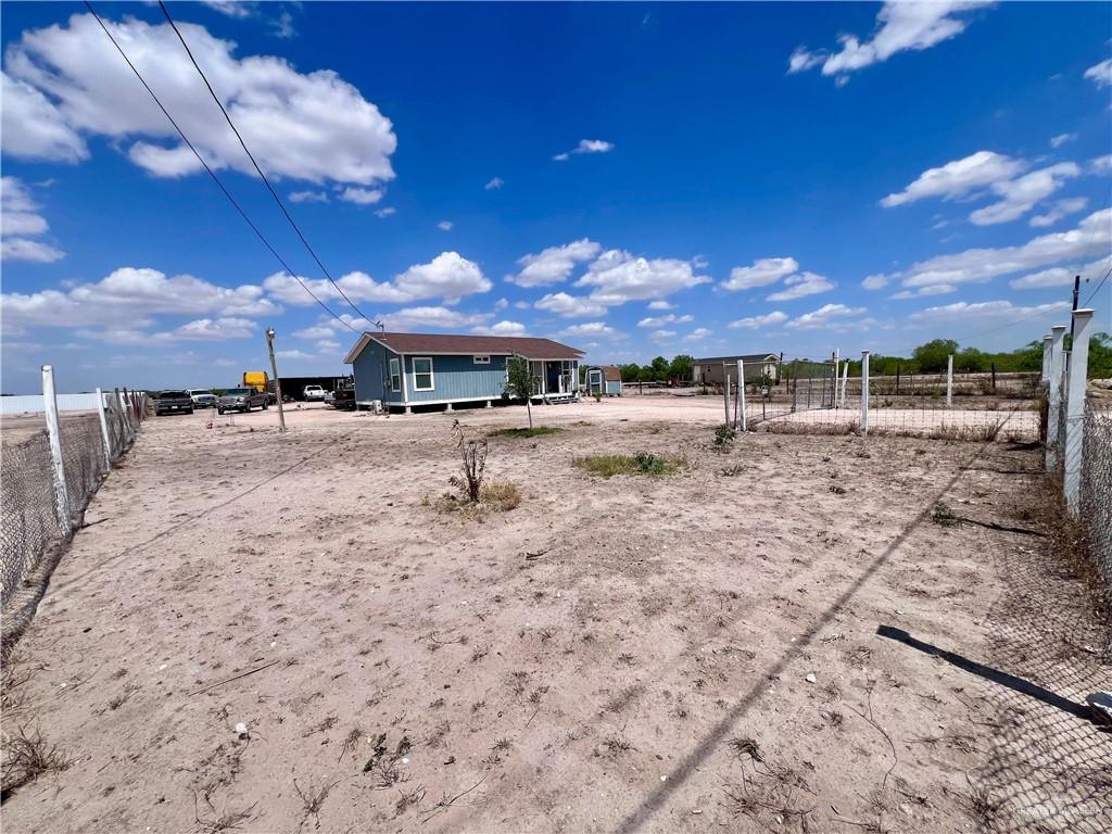 38416 El Quelite Road Penitas, TX 78576 - Photo 2 of 20 a view of a yard with a table and chairs