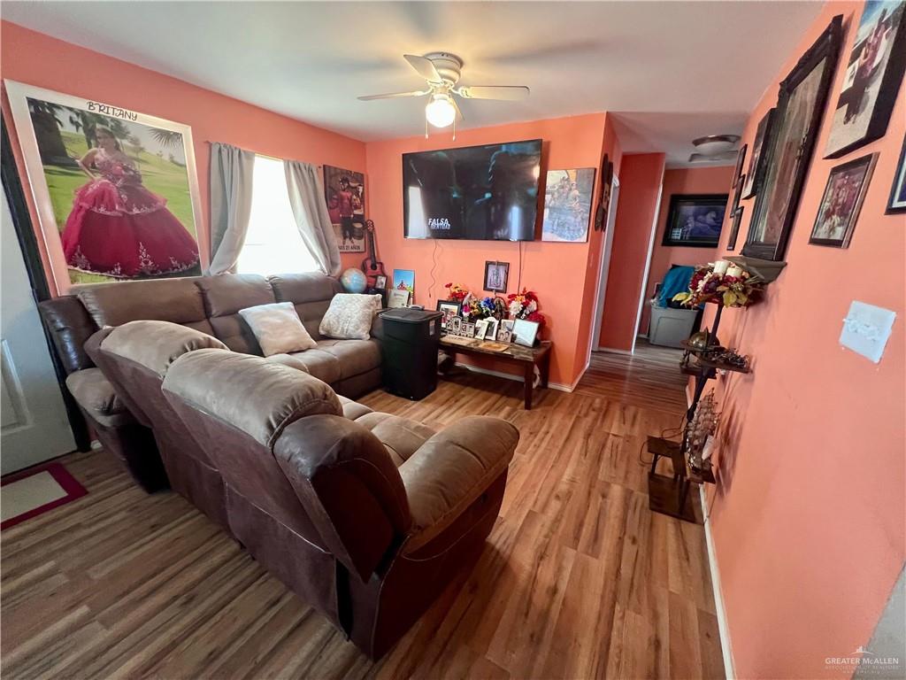 38416 El Quelite Road Penitas, TX 78576 - Photo 7 of 20 a living room with furniture and a flat screen tv
