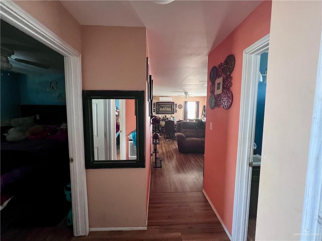 38416 El Quelite Road Penitas, TX 78576 - Photo 10 of 20 a view of a hallway with wooden floor windows and livingroom