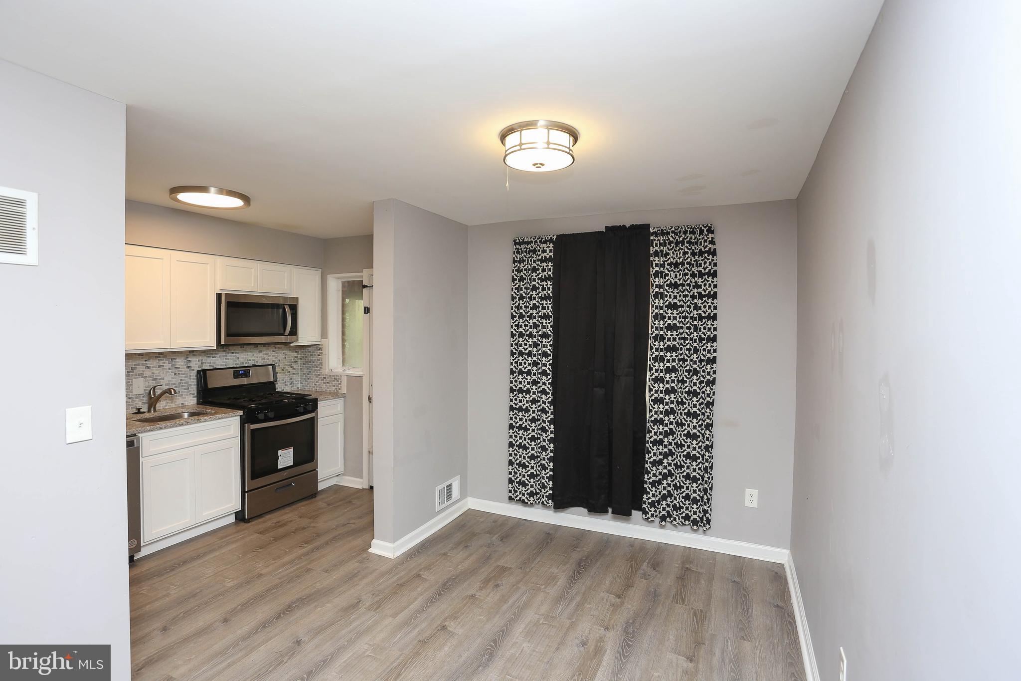 1932 Inverton Road Baltimore, MD 21222 - Photo 17 of 30 a view of kitchen with wooden floor and electronic appliances