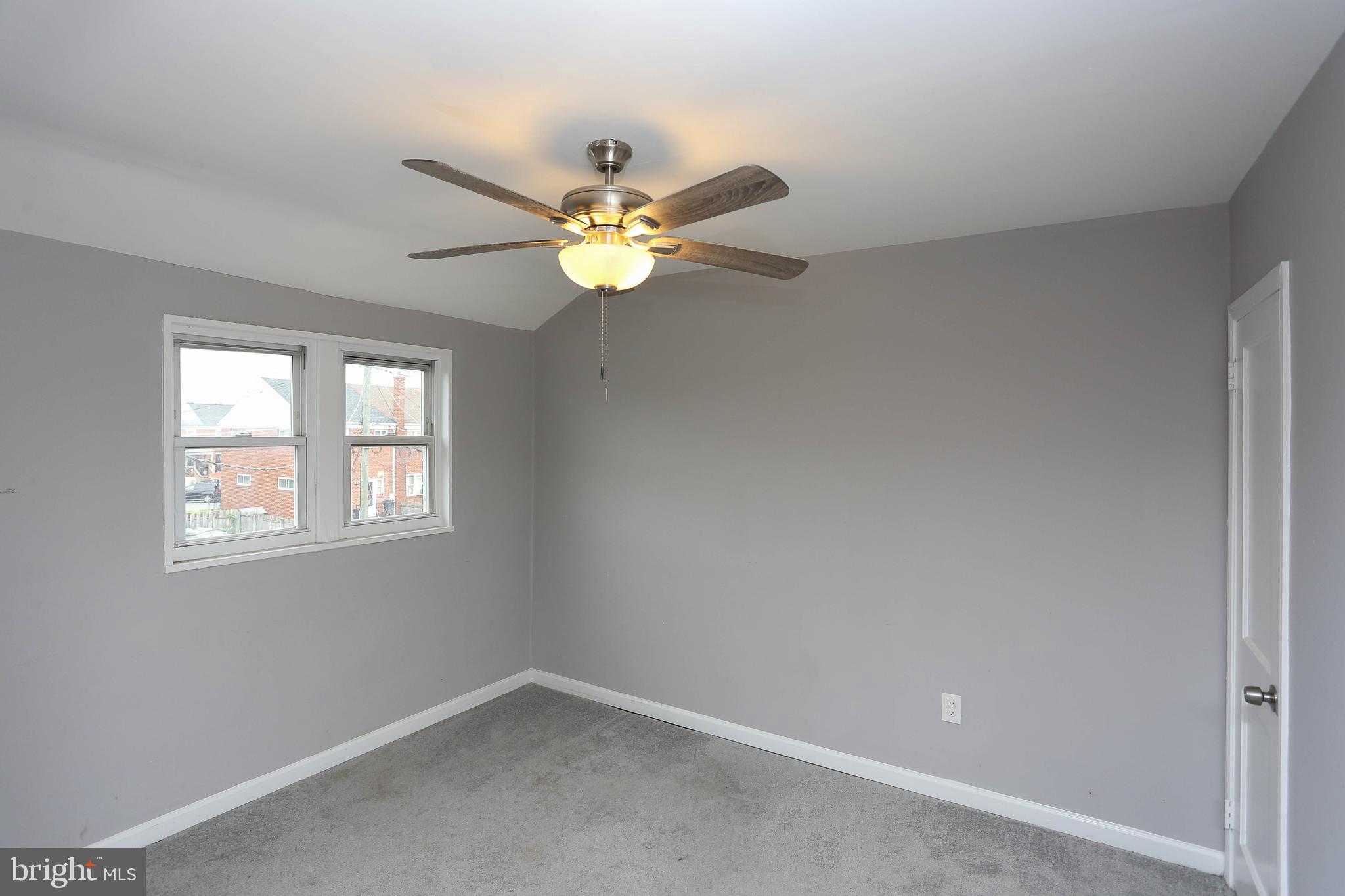 1932 Inverton Road Baltimore, MD 21222 - Photo 21 of 30 an empty room with a window and a fan