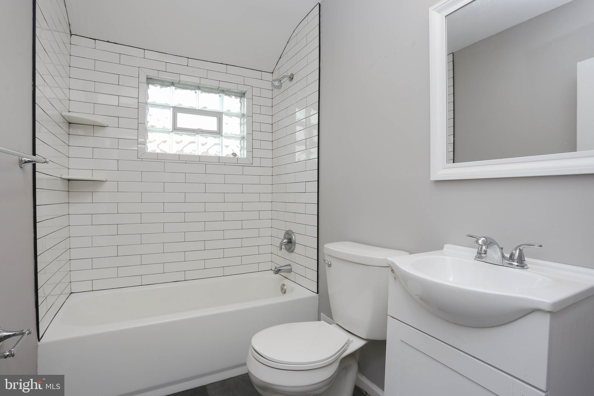 1932 Inverton Road Baltimore, MD 21222 - Photo 23 of 30 a bathroom with a sink toilet and shower
