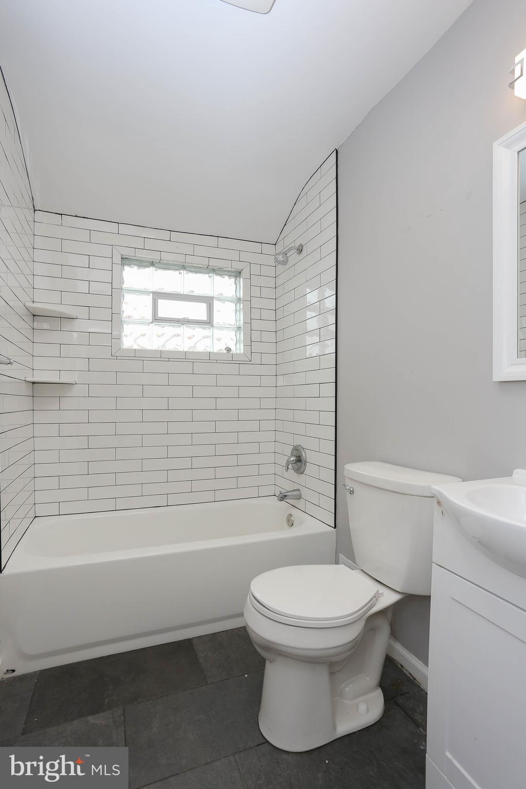 1932 Inverton Road Baltimore, MD 21222 - Photo 24 of 30 a bathroom with a toilet a sink and bathtub