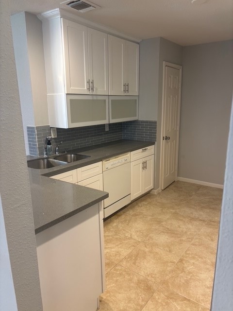 2211 South Kirkwood Road, Unit 22 Houston, TX 77077 - Photo 4 of 15 a kitchen with granite countertop white cabinets and white appliances