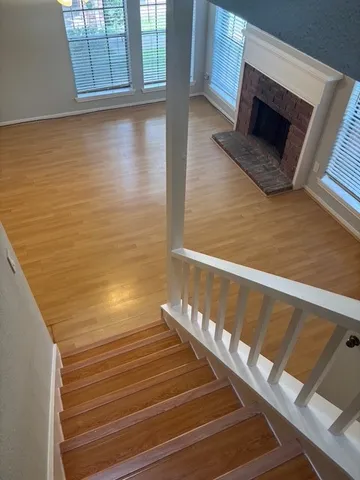 a view of wooden floor with staircase