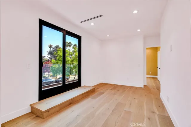 a view of a bathroom with a sink and mirror