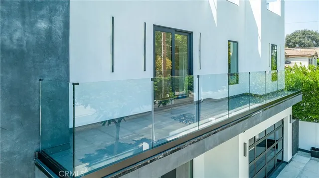 a view of a big room with windows and cabinet