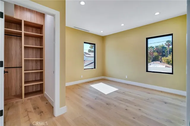a living room with furniture a fireplace and a potted plant