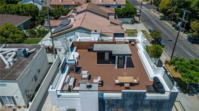a view of an house with backyard space and balcony