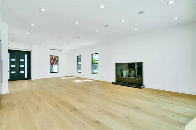 a view of an empty room with a fireplace