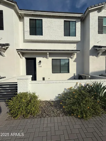 a front view of a house with a garage