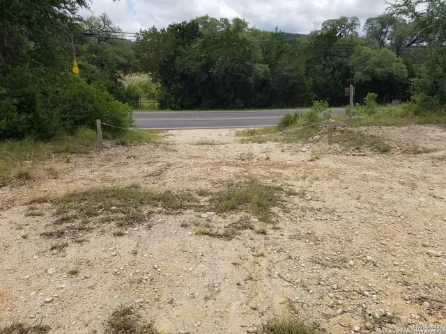 a view of outdoor space with trees all around