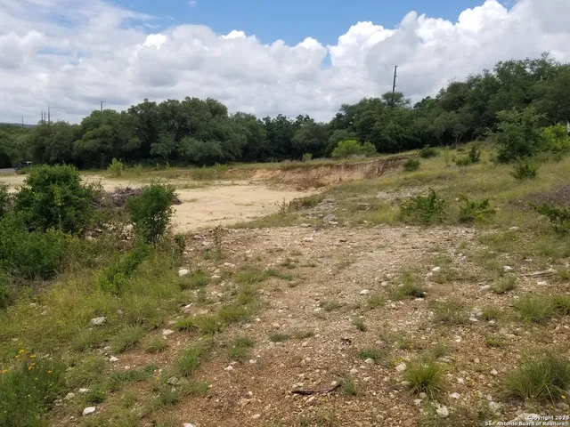 a view of a lake with houses in the back
