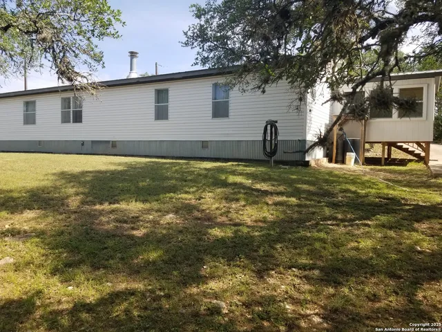 a house view with a swimming pool