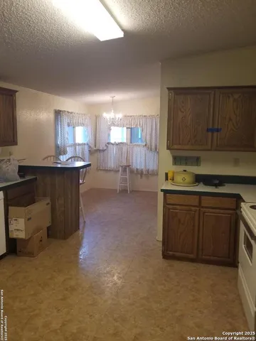 a kitchen with lots of counter top space and appliances