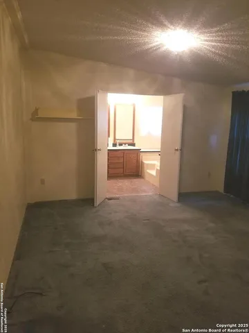 en empty room with windows