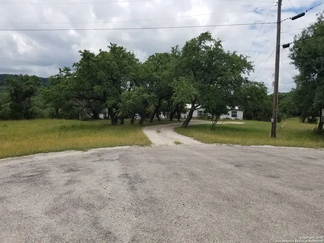 a view of a swimming pool and a yard
