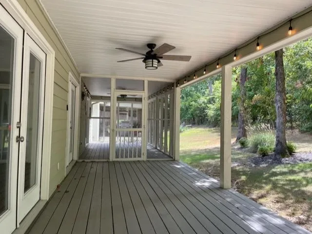 a view of a porch with wooden floor and outdoor space