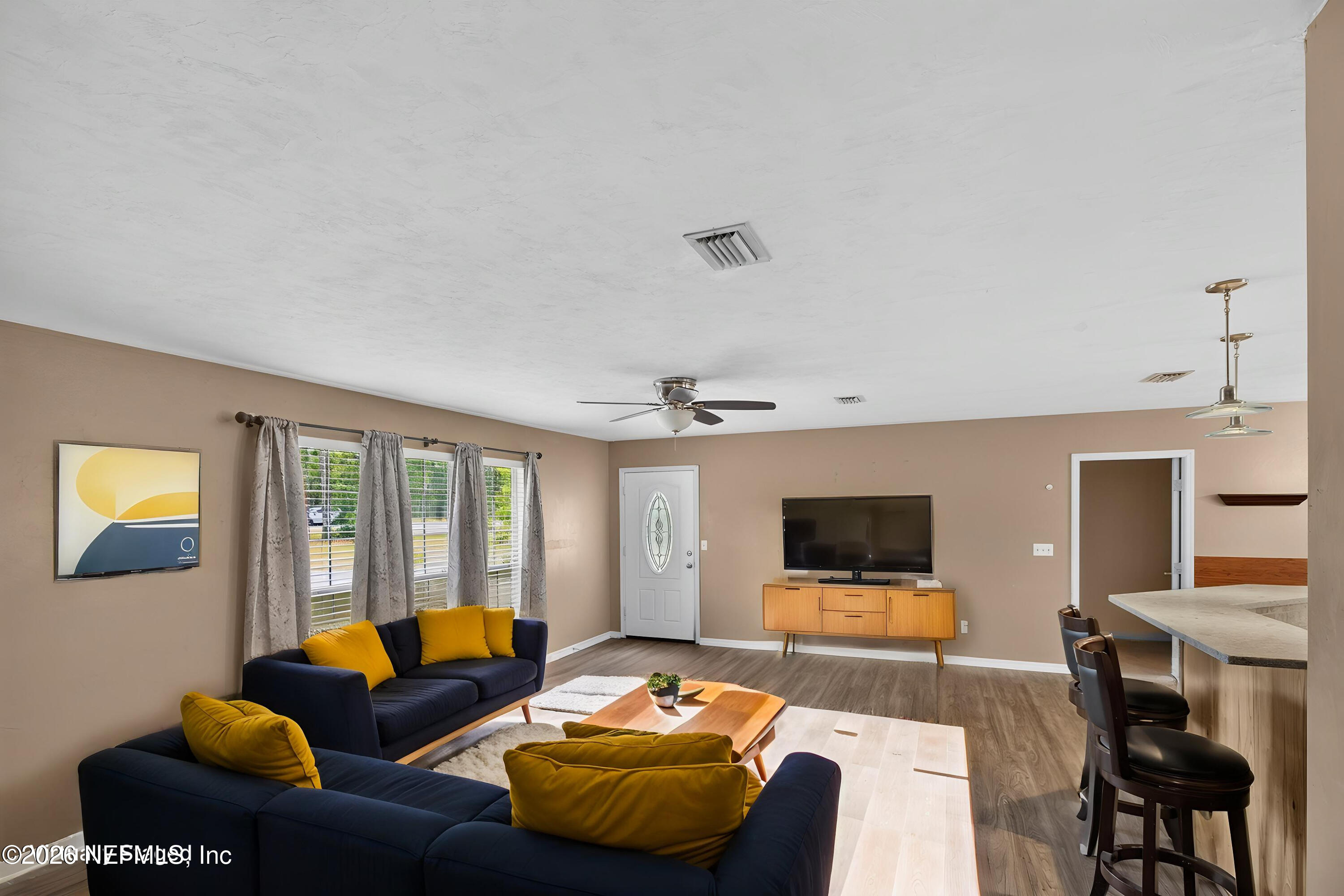 692 Southeast 41st Street Keystone Heights, FL 32656 - Photo 21 of 58 692se41st_MLS-45 - Living Room - Mid-Cen