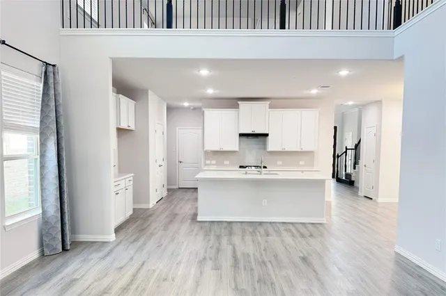 a view of kitchen with stainless steel appliances refrigerator oven and stove
