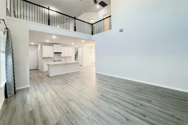 a view of kitchen with cabinets and wooden floor