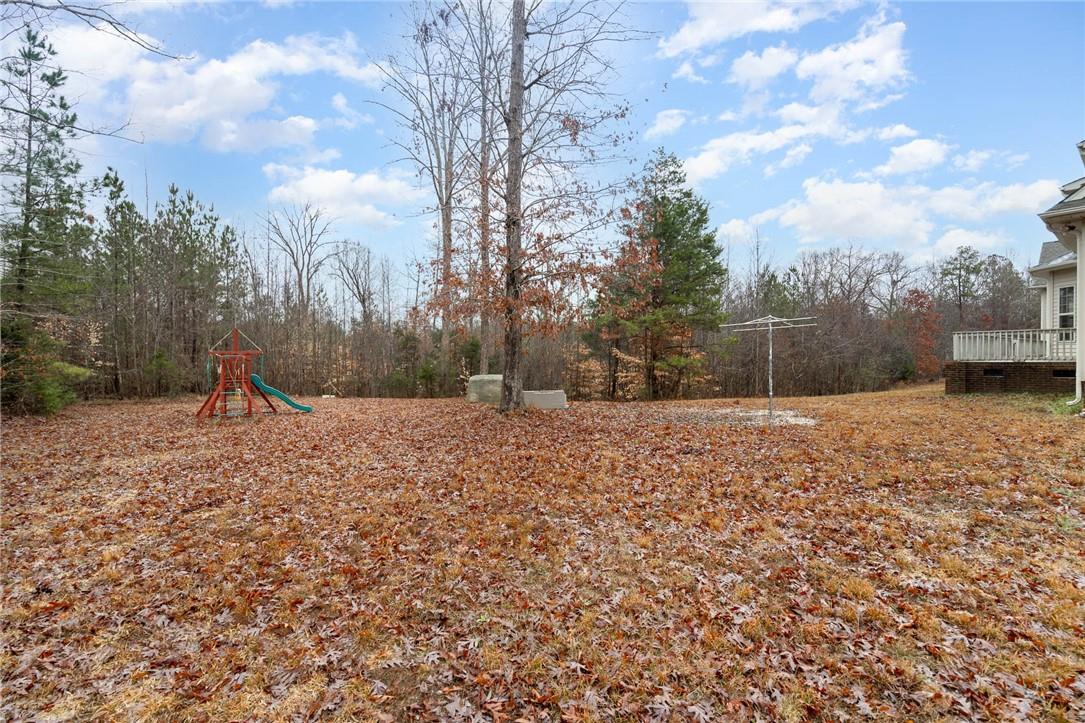 4793 Logging Road Lancaster, SC 29720 - Photo 29 of 32 a backyard of a house with large trees