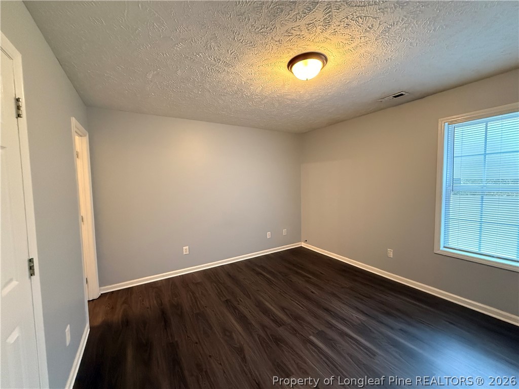 231 Bahia Lane Raeford, NC 28376 - Photo 8 of 10 an empty room with windows