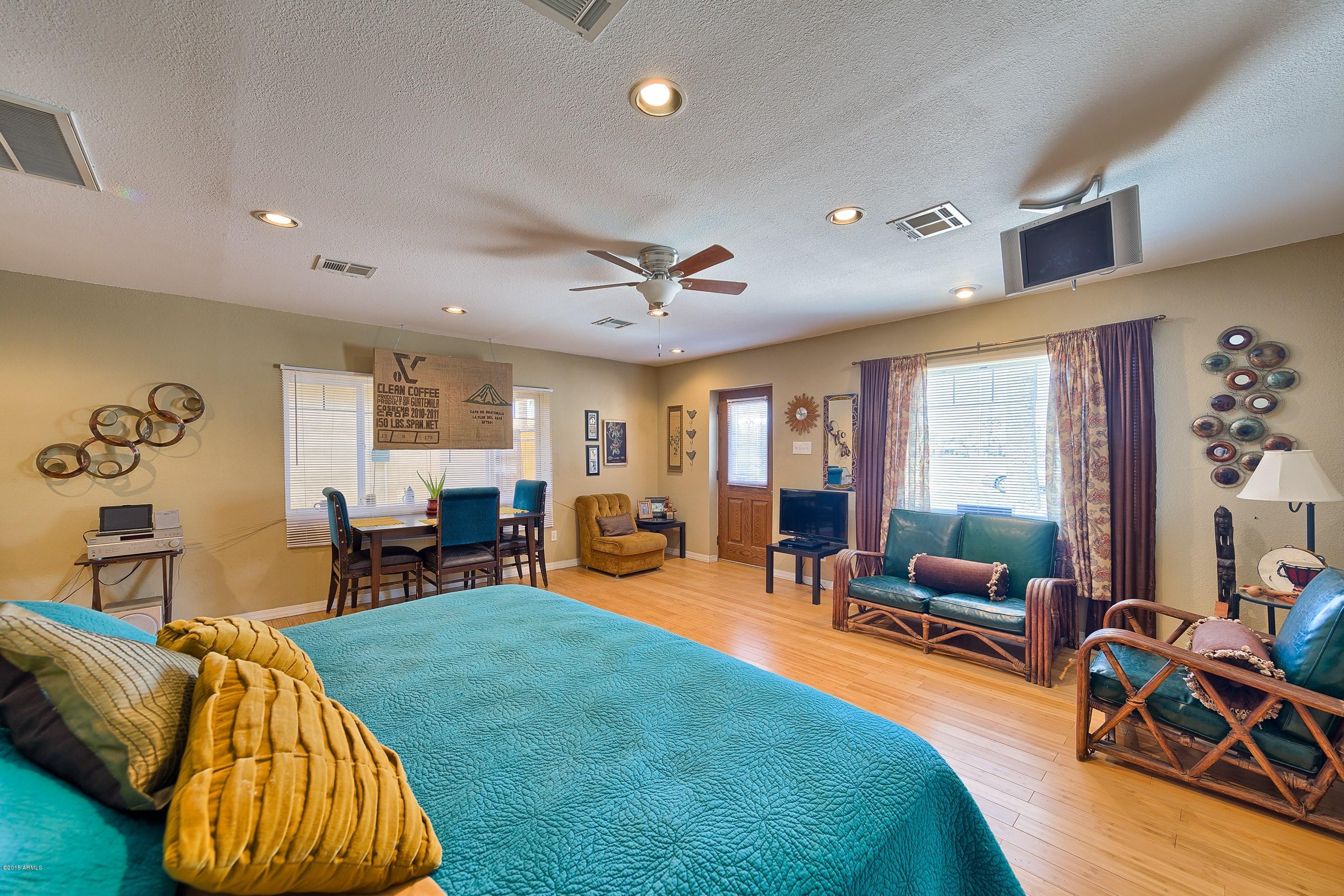 1601 North 13th Avenue Phoenix, AZ 85007 - Photo 14 of 18 a living room with furniture and a large window
