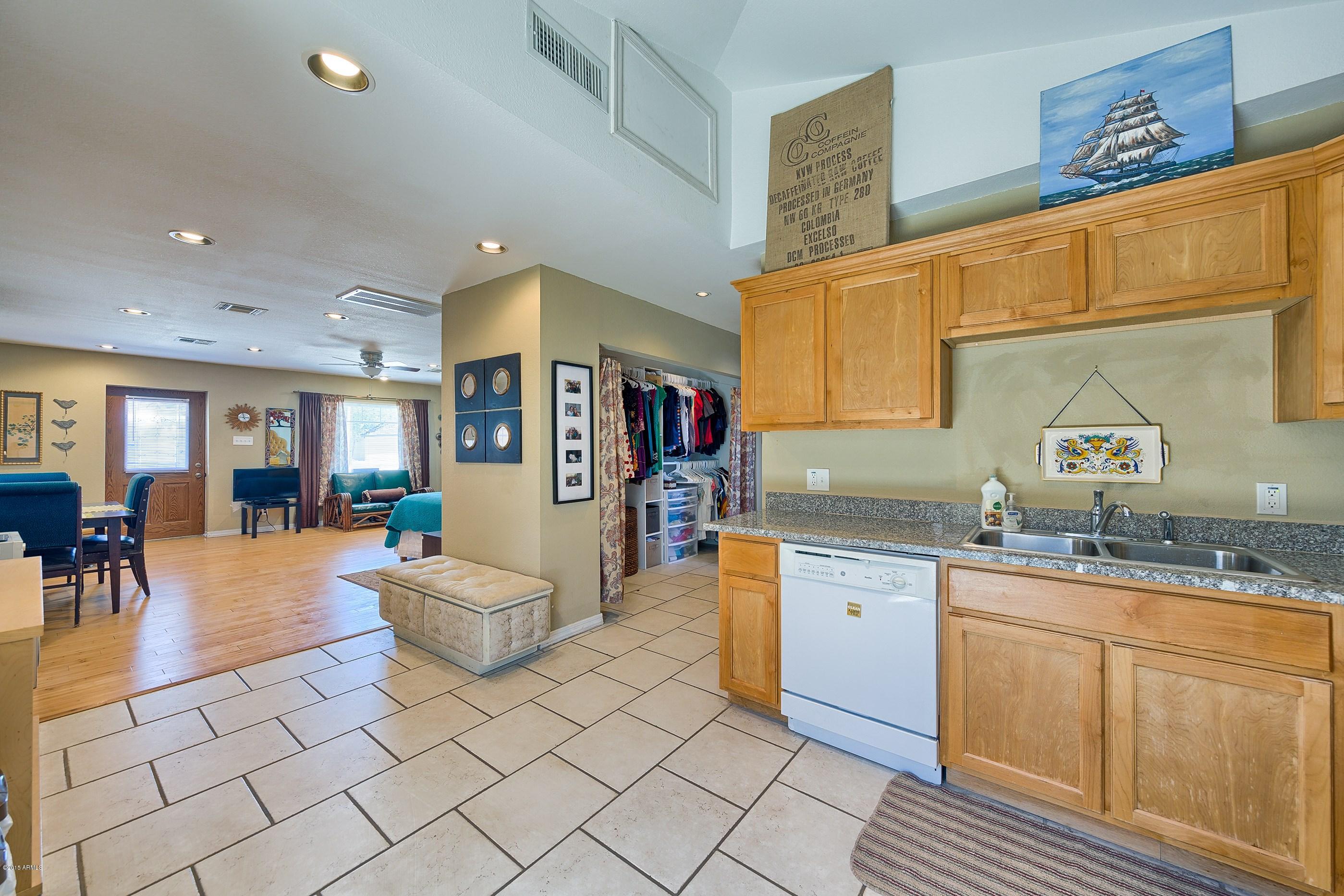 1601 North 13th Avenue Phoenix, AZ 85007 - Photo 16 of 18 a living room with granite countertop furniture and a kitchen view
