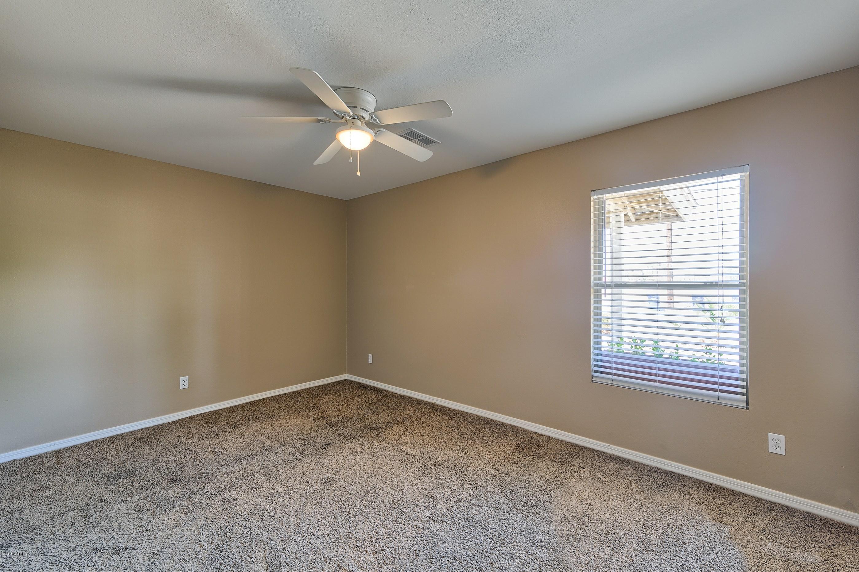 1601 North 13th Avenue Phoenix, AZ 85007 - Photo 10 of 18 a view of an empty room with a window