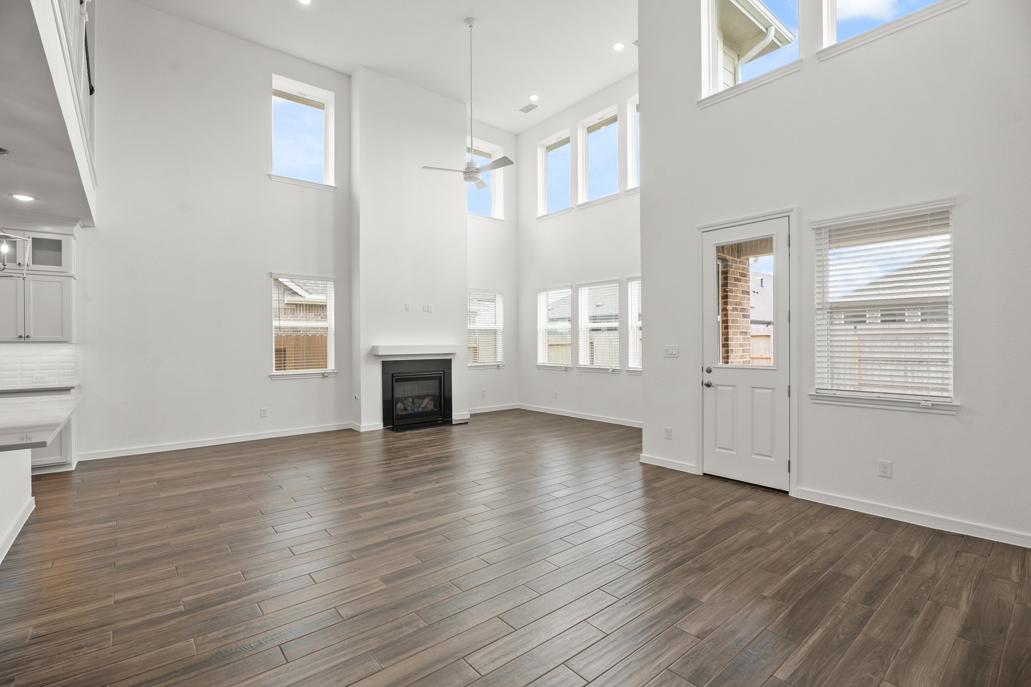 2819 Clapbread Lane Rosenberg, TX 77471 - Photo 8 of 45 Impressive great room with cozy fireplace (*Photo not of actual home and used for illustration purposes only.)