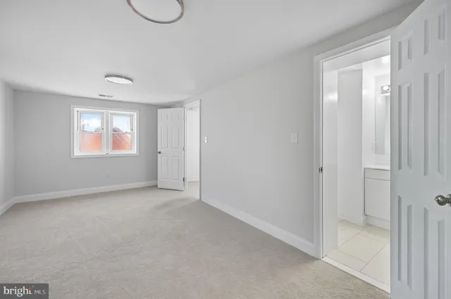 a view of an empty room with windows