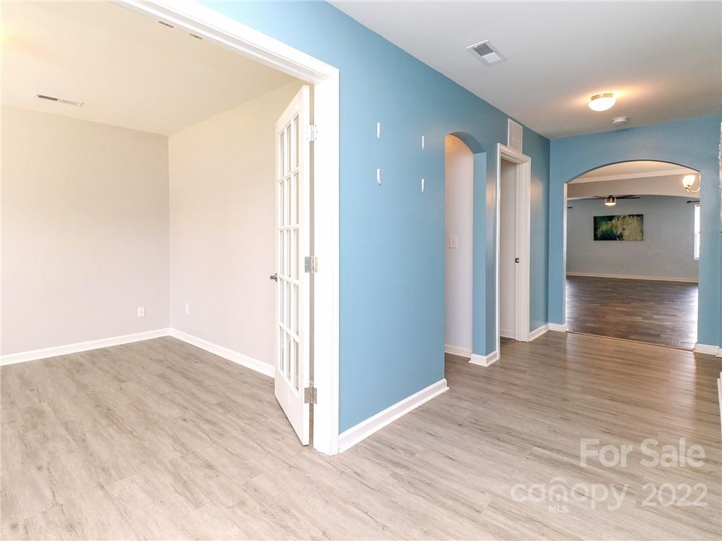 12547 Gotland Road Midland, NC 28107 - Photo 5 of 40 a view of a hallway with wooden floor